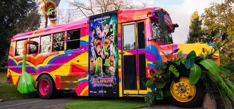 Amazon promotes "Hotel Transylvania: Transformation" with huge balloons and technicolor tour buses